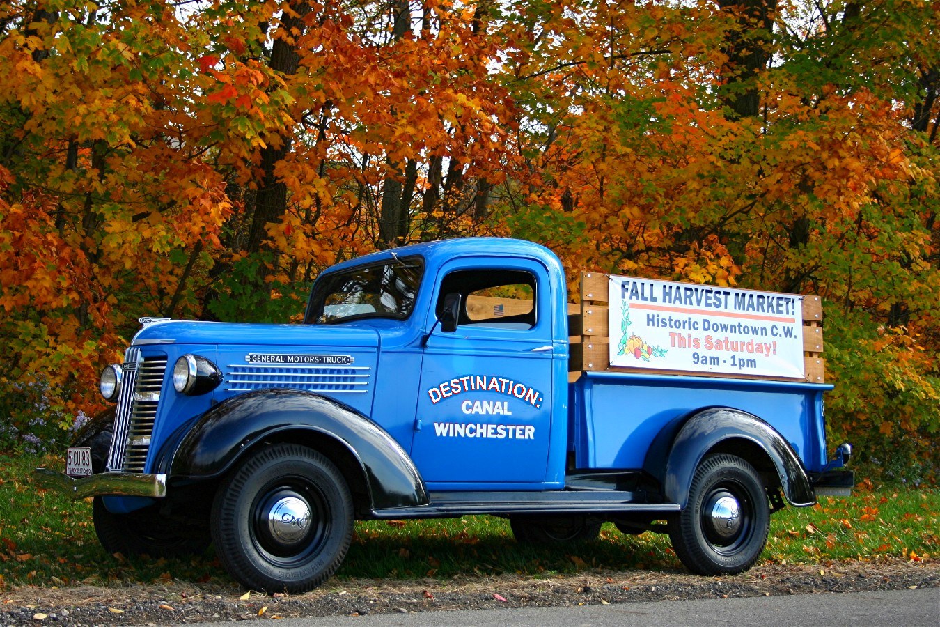 Blue Destination: Canal Winchester truck advertising the Fall Harvest Market