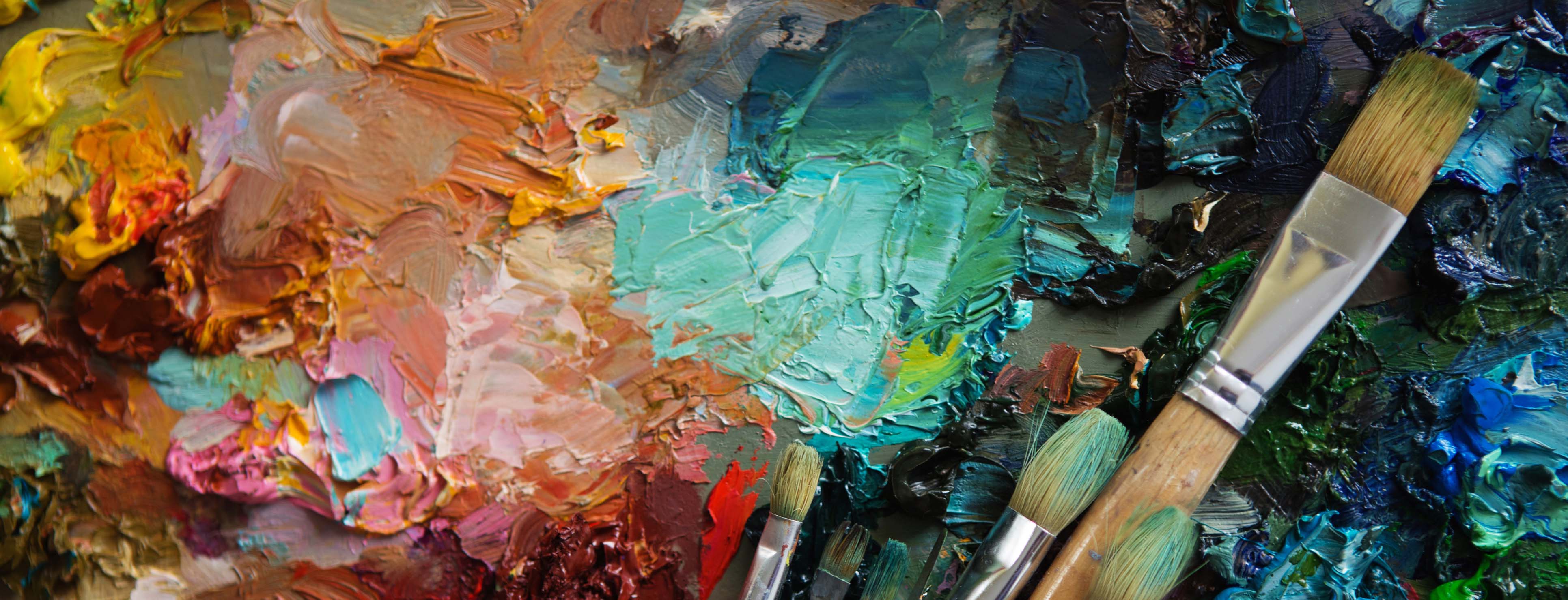 Oil paint and brushes on an artist palette