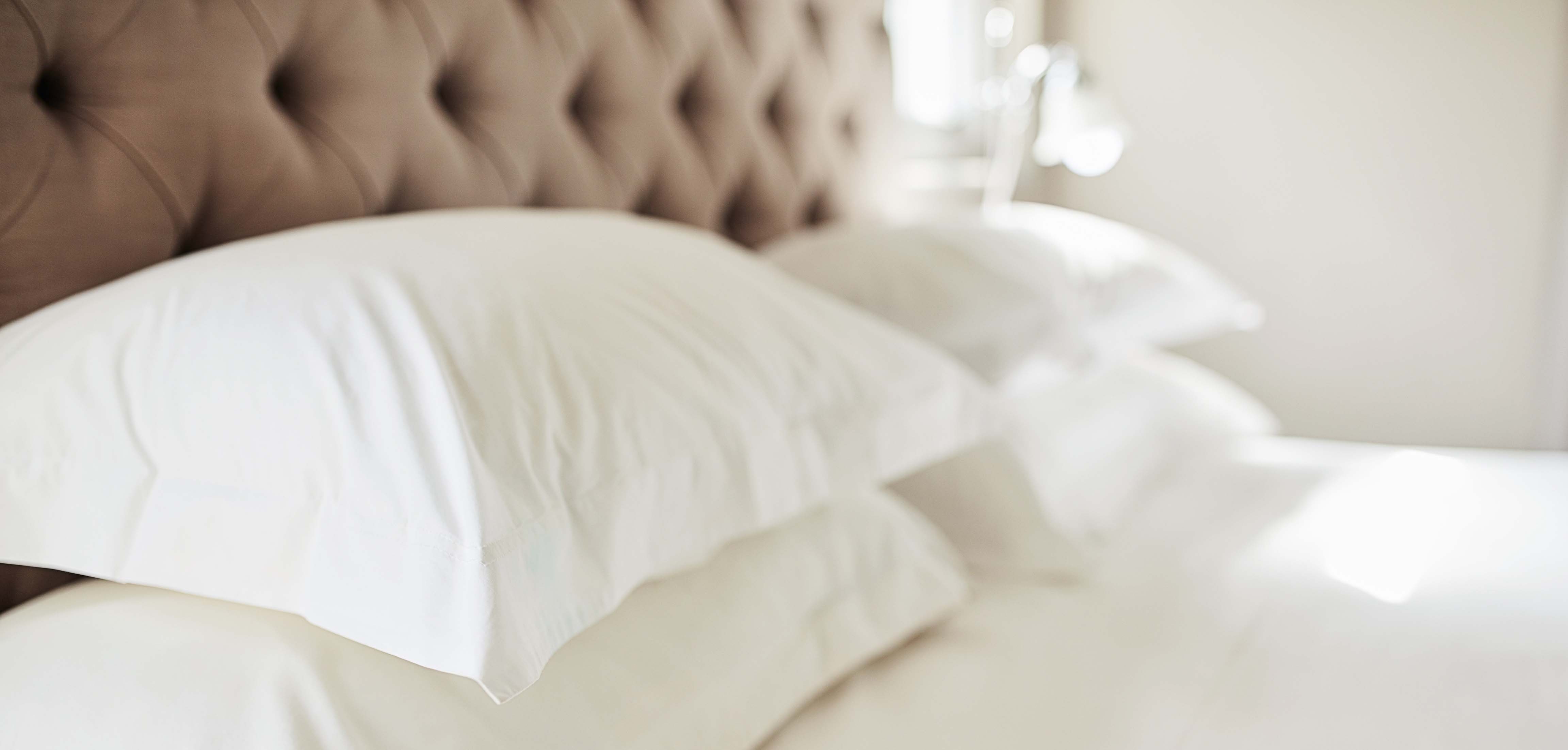 White pillows on a hotel bed