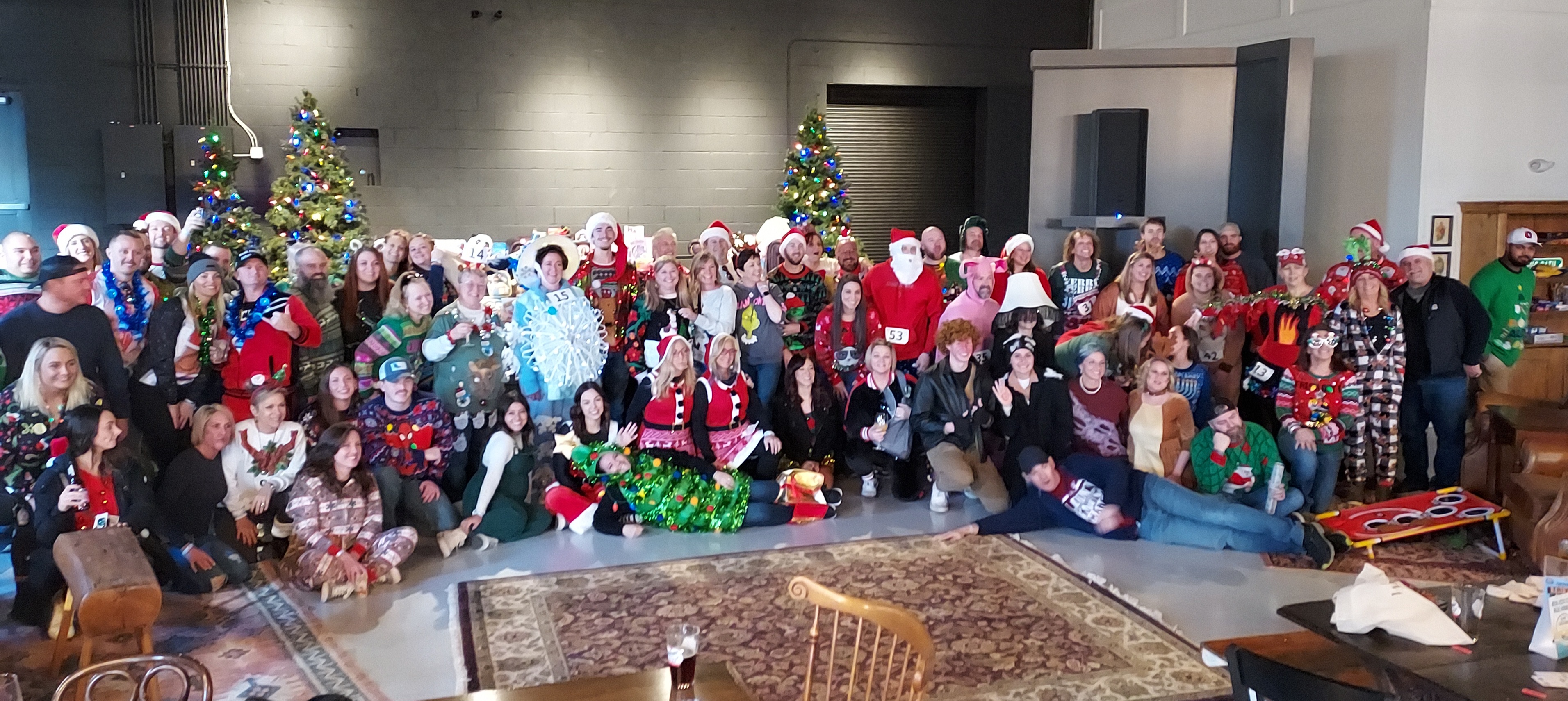 Reindeer Games participants in holiday costumes and ugly sweaters