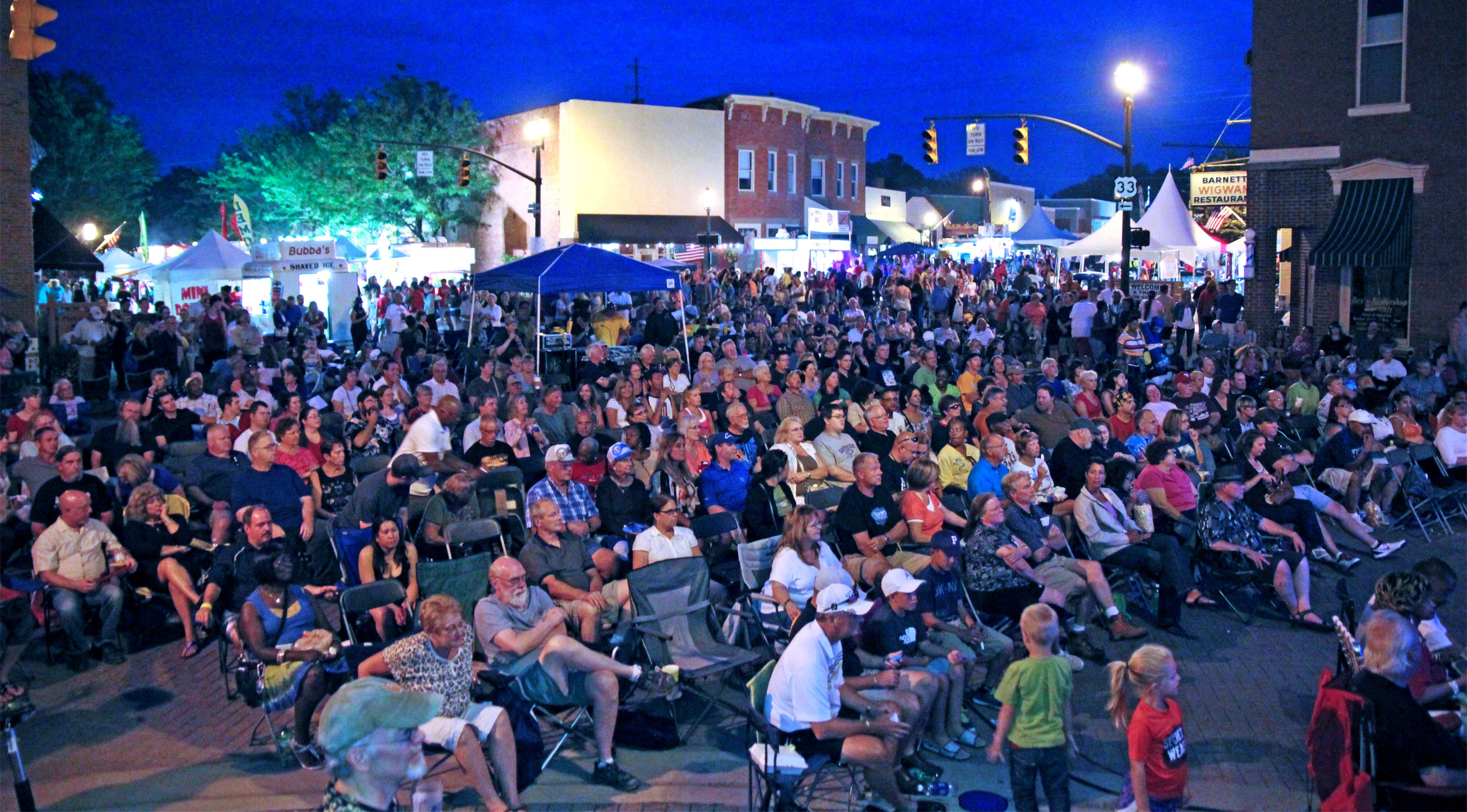 Crowd gathered on High Street for a downtown Canal Winchester festival at night