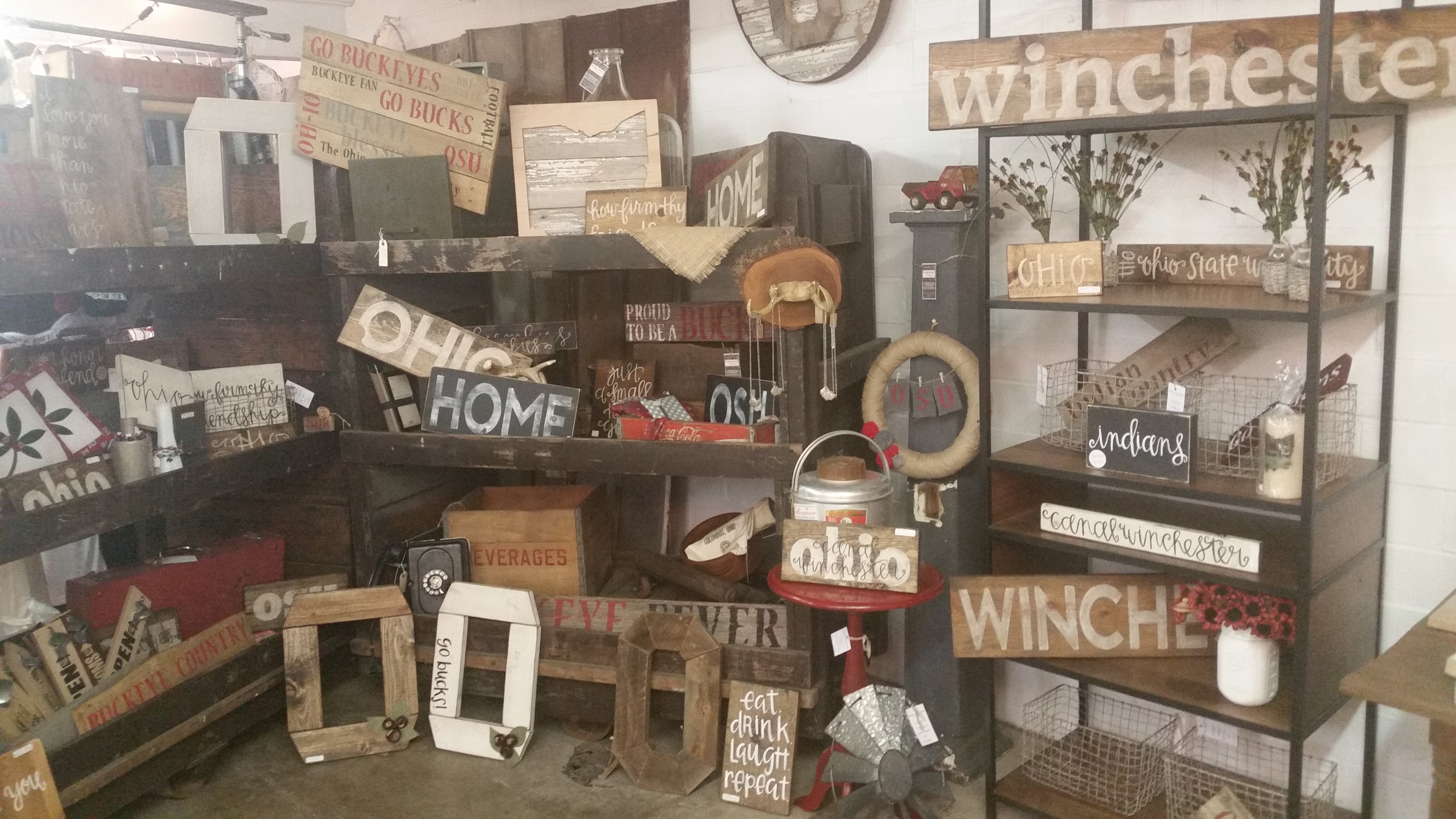 Handmade Ohio and Canal Winchester signs at a downtown shop